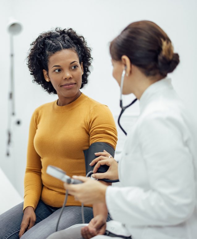 Female Patient Having Blood Pressure Test