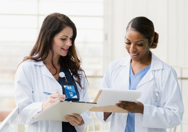 Female Physicians Reviewing Paperwork